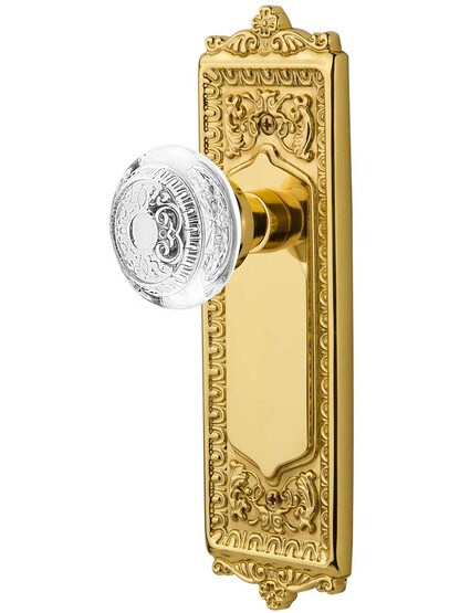 Egg and Dart Door Set with Matching Crystal-Glass Knobs in Polished Brass.